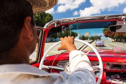 Driving an old car in the street of Havana, Cuba